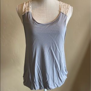 Free People slouchy tank with sheer lace back.